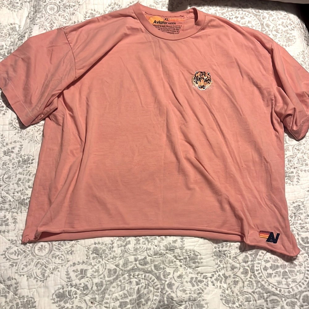 This is a peach XL Aviator nation shirt with an embroidered cheetah.